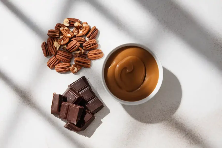 Key ingredients of pecan delights and Turtles: pecans, caramel, and chocolate